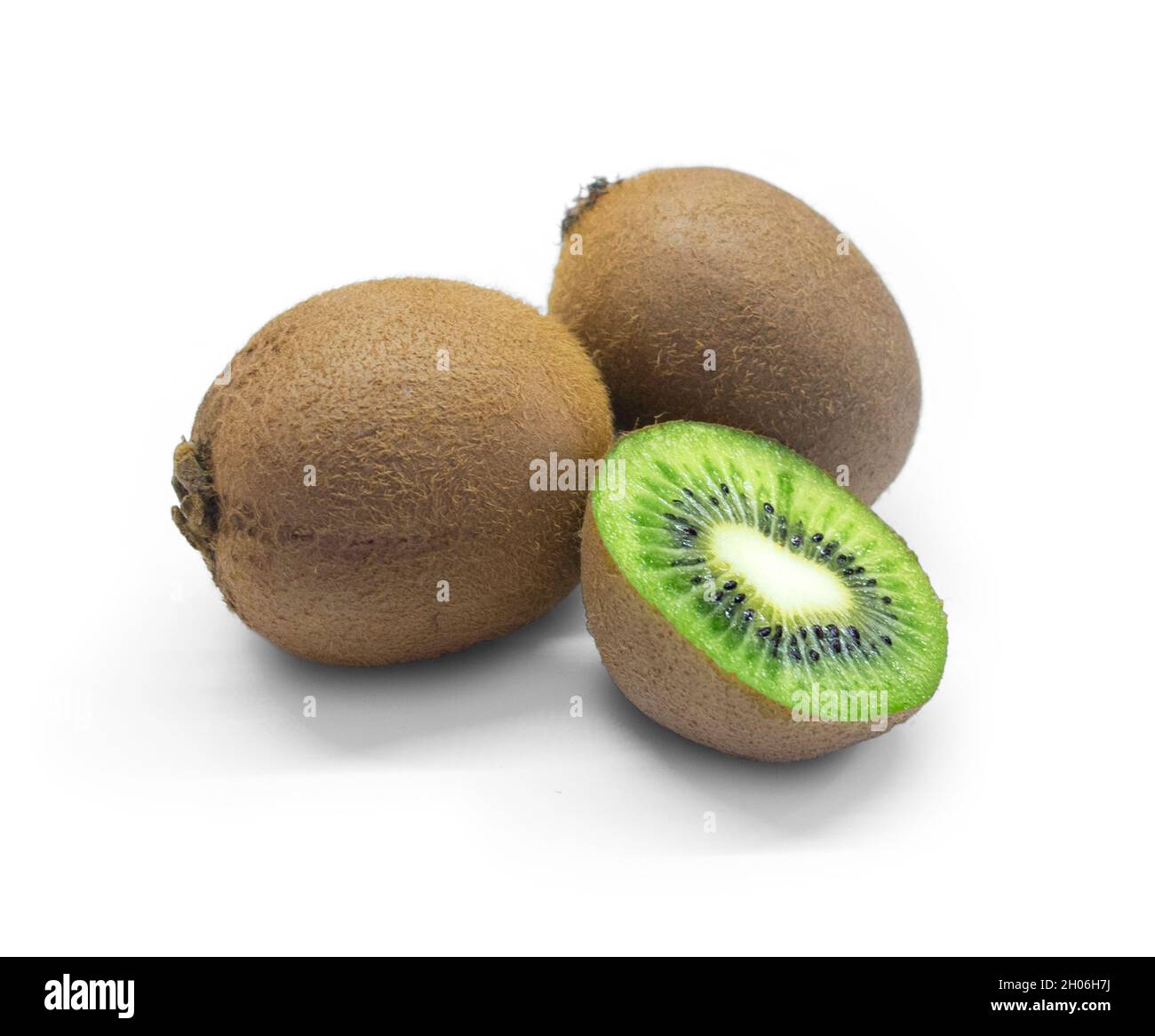 Two hole kiwi fruit and half kiwi fruit isolated on white background Stock Photo