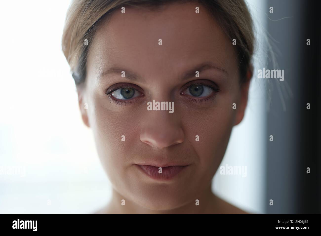 Portrait of young beautiful woman with squint eyes Stock Photo Alamy