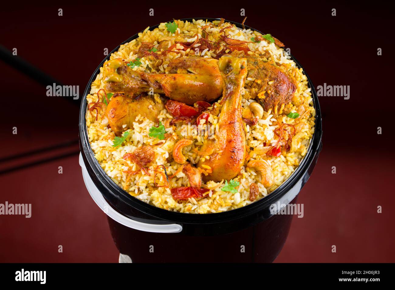 Chicken Bucket Biryani, Kerala dum chicken biryani arranged in a black bucket container with