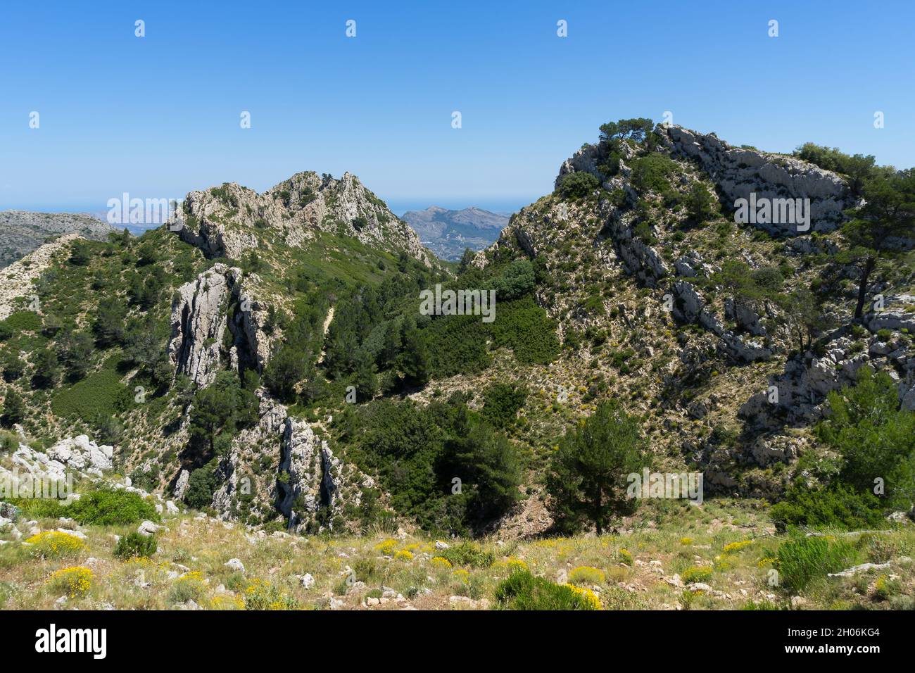 beautiful green mediterranean landscape and majestic mountain crest in Spain tranquil nature Stock Photo