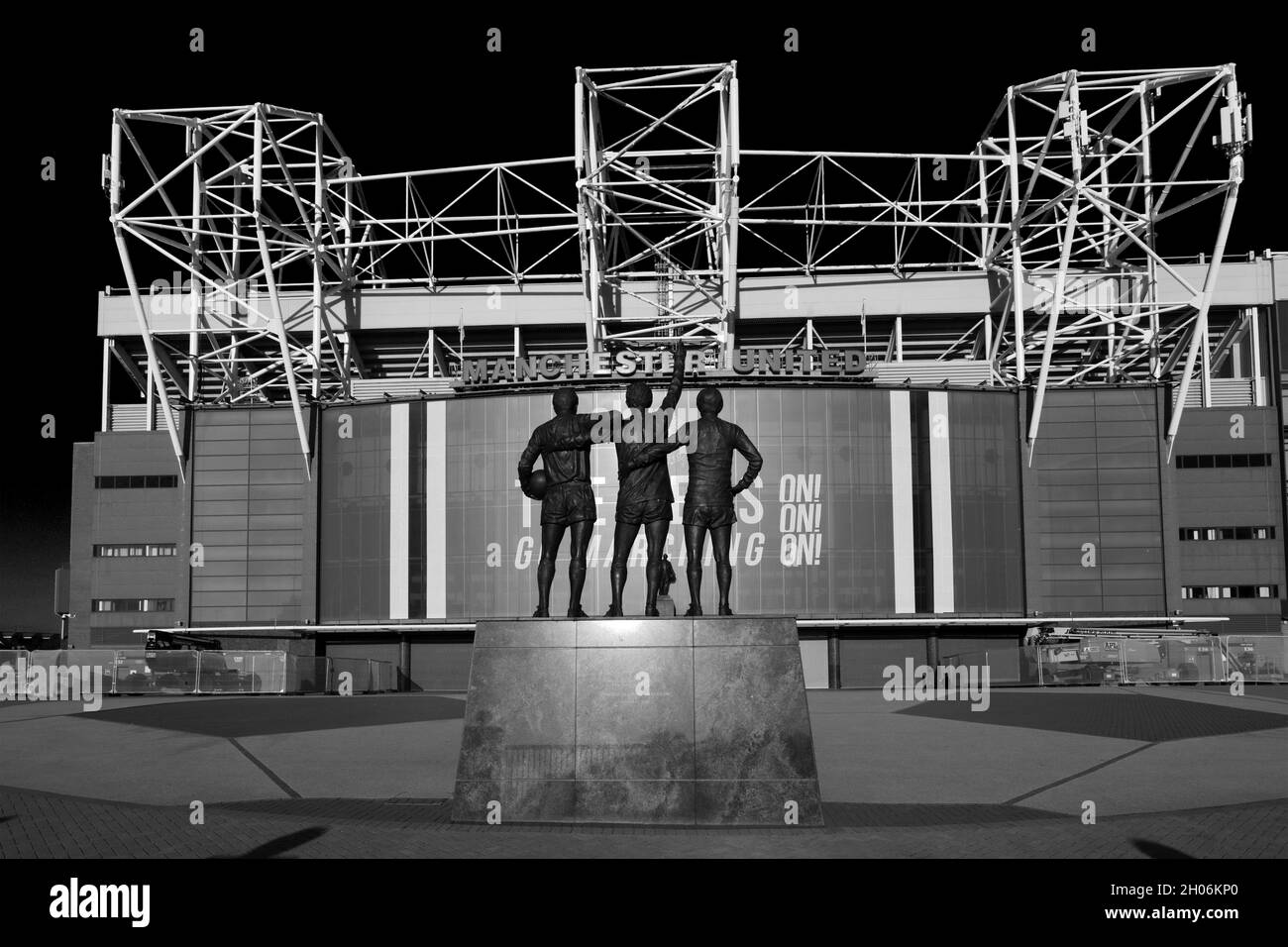 The United Trinity sculptor by Philip Jackson, Manchester United's Old Trafford ground, Manchester, England, UK Stock Photo