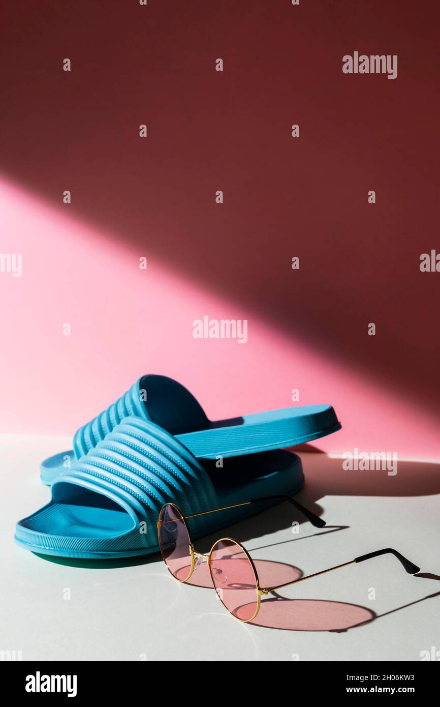 Sunglasses and flip flops arrangement Stock Photo - Alamy