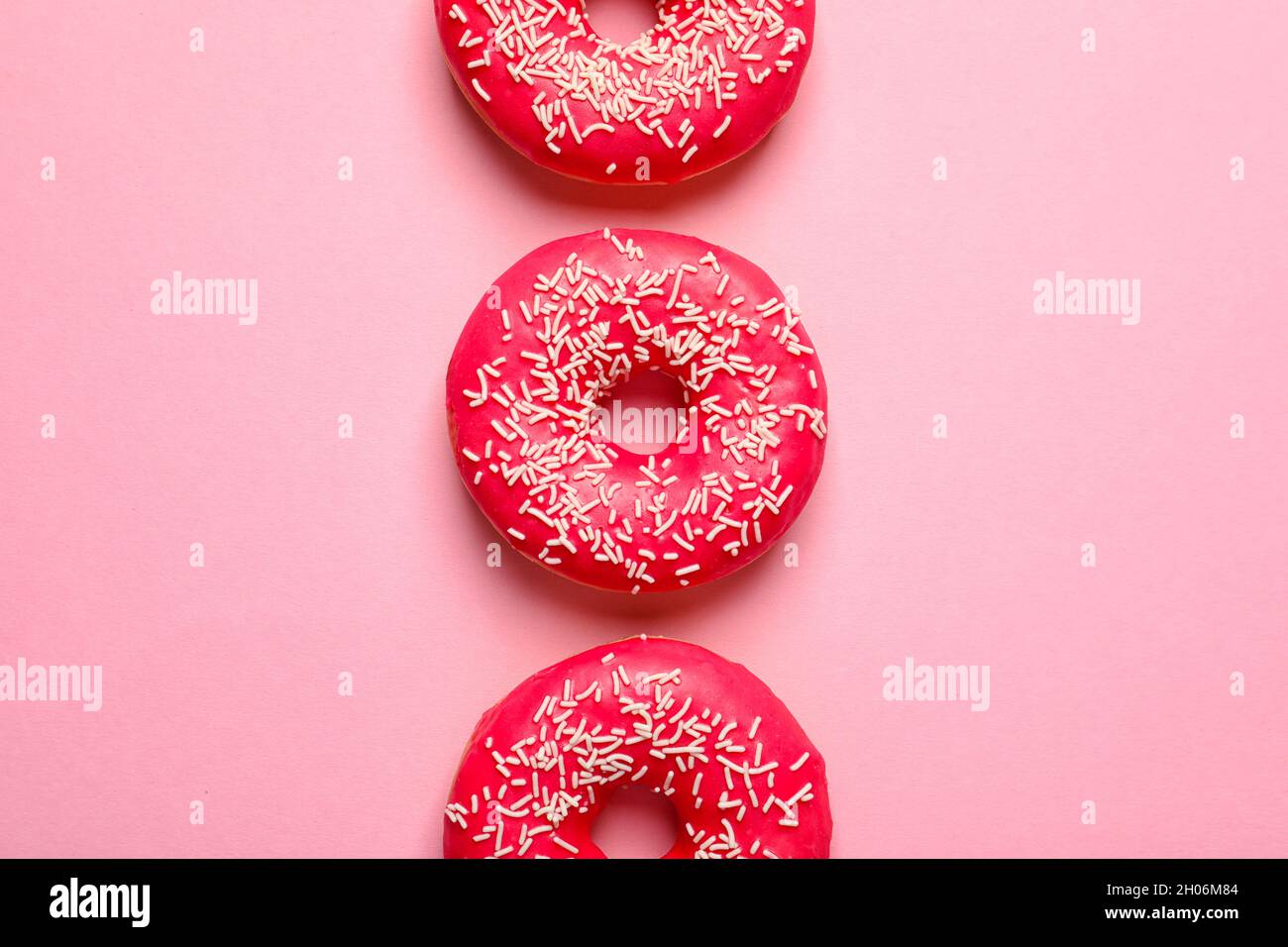 Delicious glazed doughnuts on color background, top view Stock Photo ...