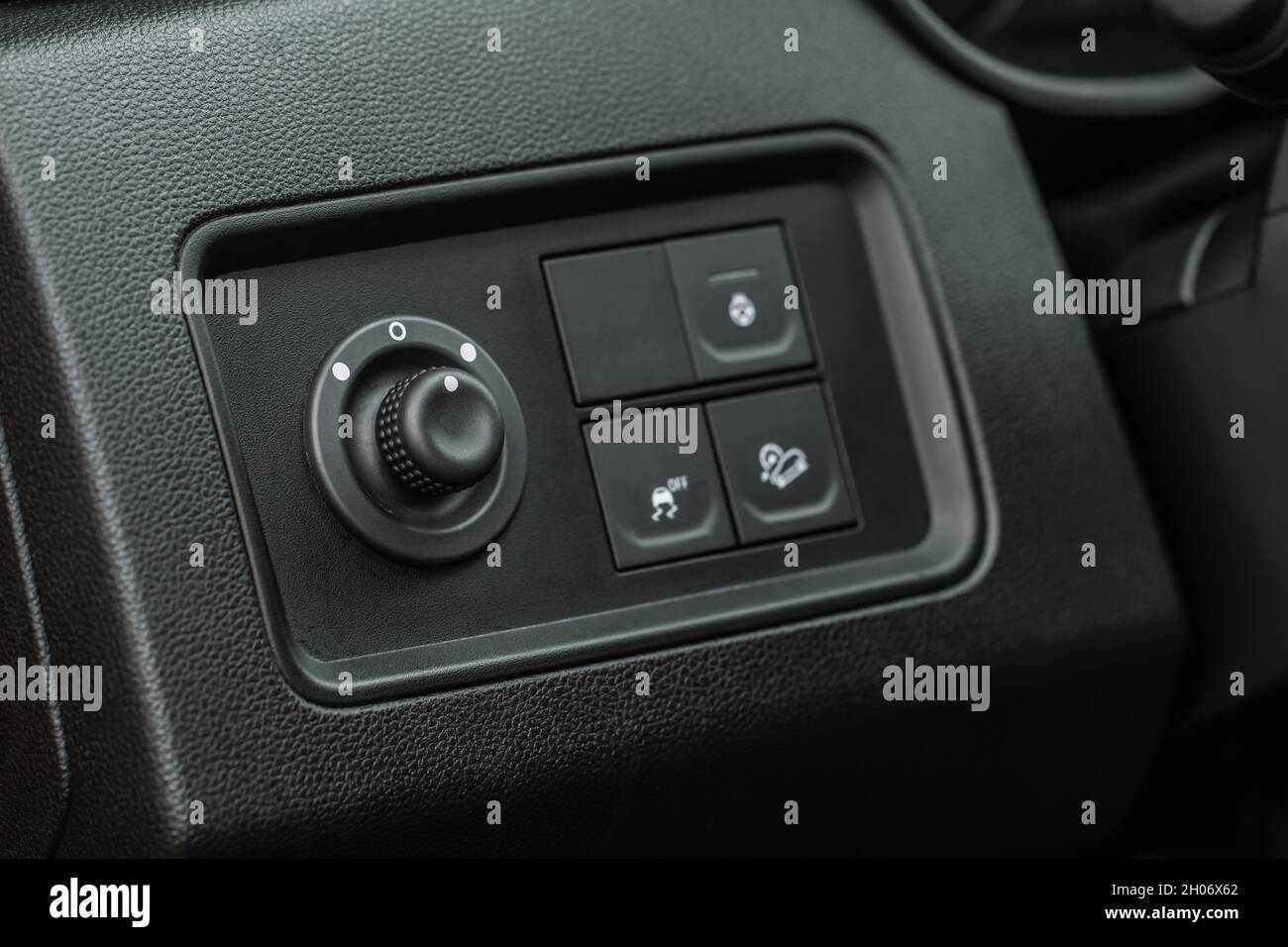 Side mirrors control panel on side door. Car driver adjust side mirror