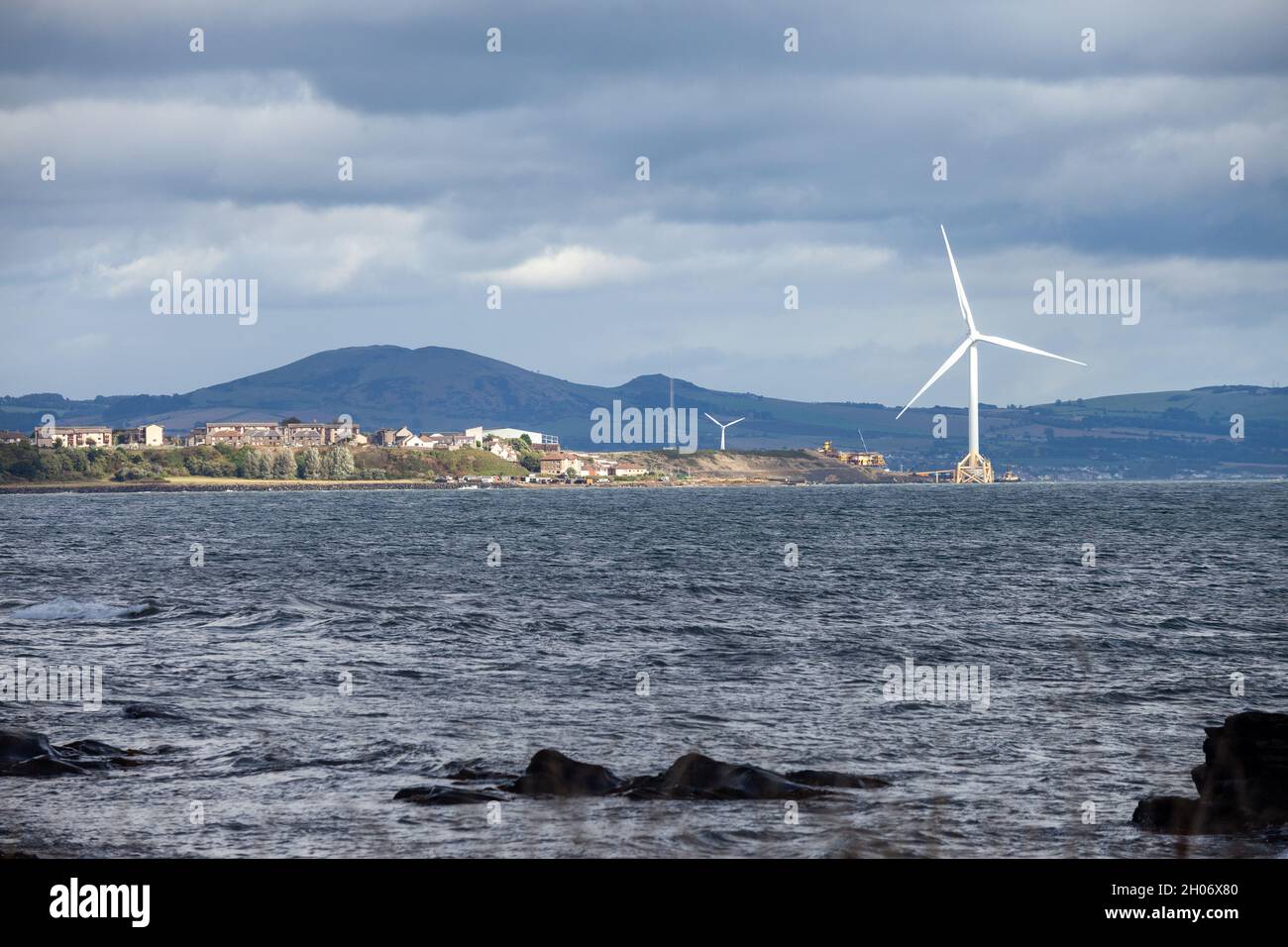 Looking towards the wind turbine at Buckaven from East Wemyss along the fife coastal path Stock Photo