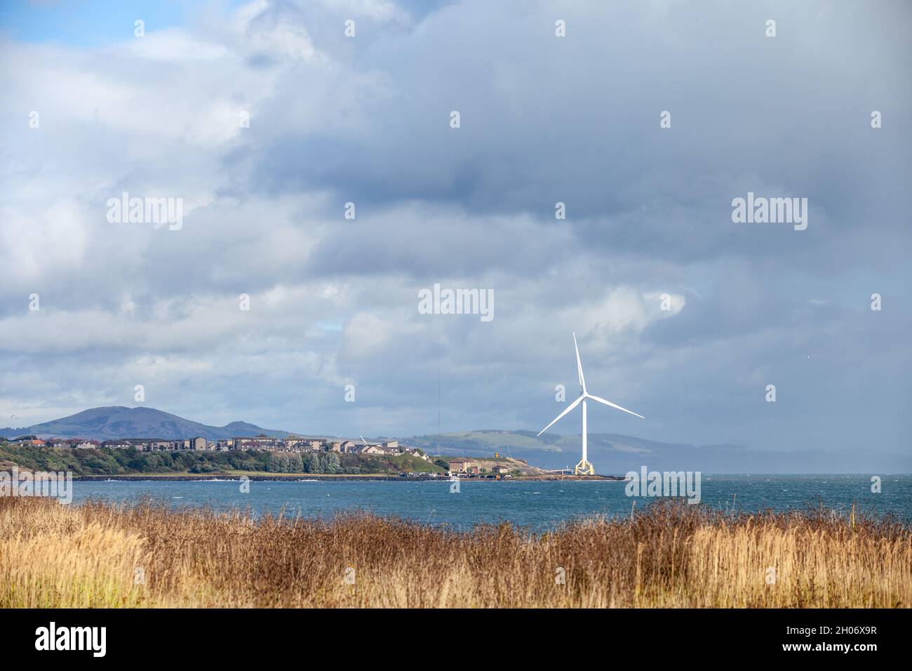 Looking towards the wind turbine at Buckaven from East Wemyss along the fife coastal path Stock Photo