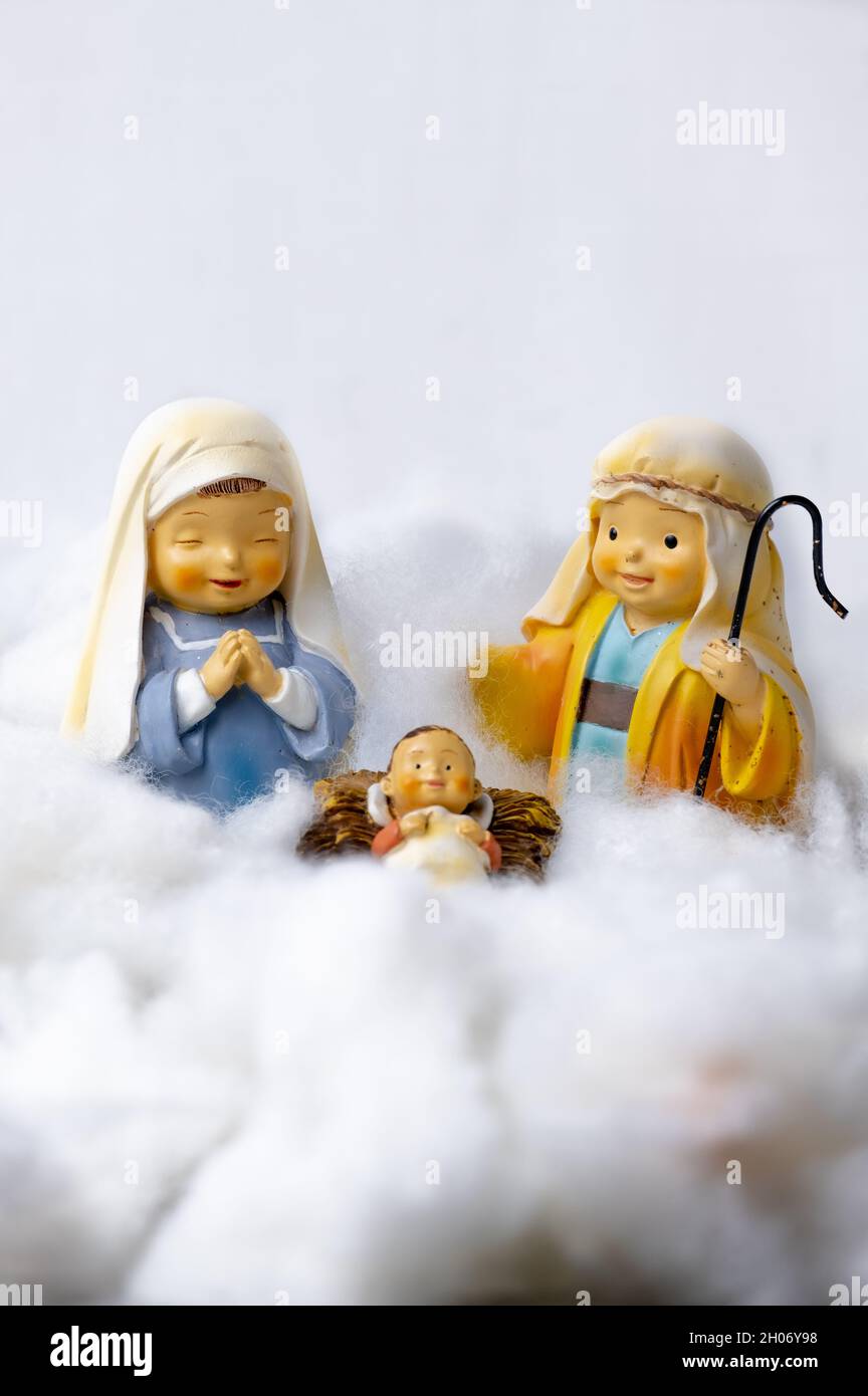Figures of Portal de Belén on cotton simulating clouds. Christmas greeting concept. Copy Space Stock Photo