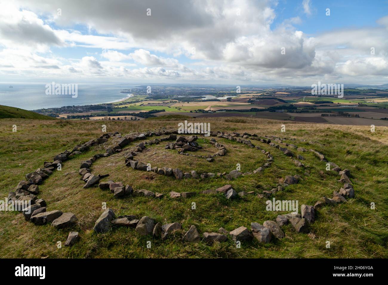 A spiral circle of stones at the summit of Largo Law Hill, Fife. Stock Photo
