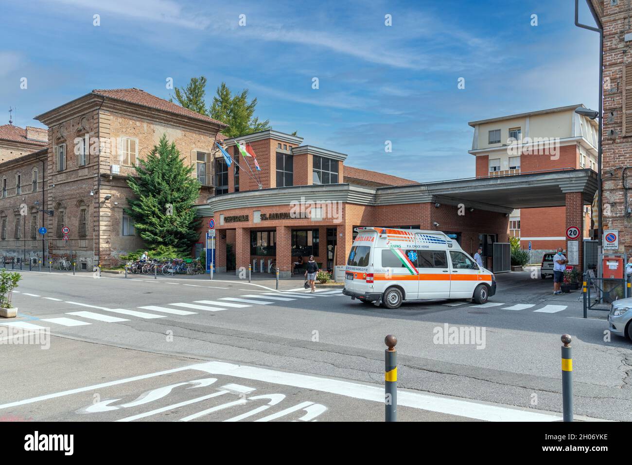 Savigliano, Cuneo, Italy - September 10, 2021: Main entrance of the SS Annunziata hospital with Ambulance of the Italian Green Cross Stock Photo
