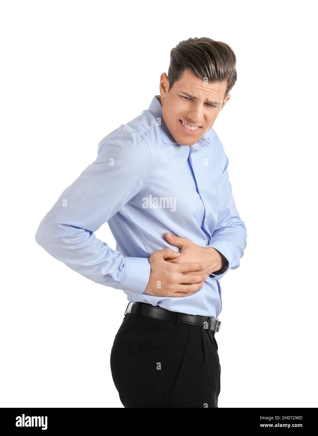Man suffering from flank pain on white background Stock Photo - Alamy