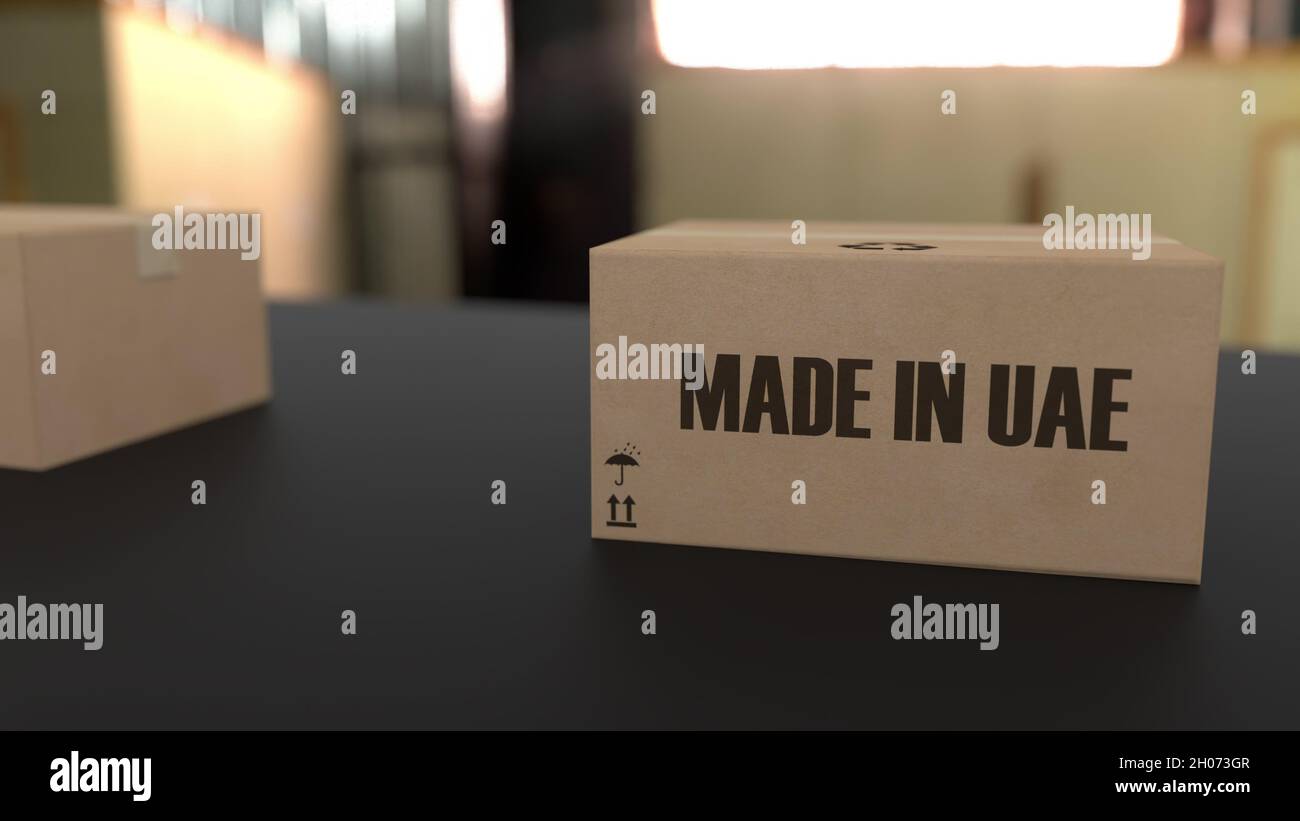 Boxes with MADE IN UAE text on conveyor. United Arab Emirates goods