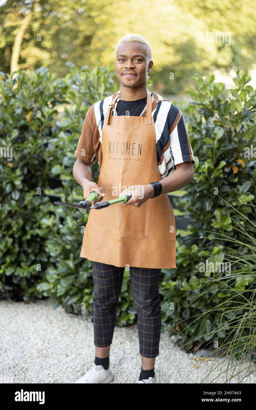Hispanic male gardening hi-res stock photography and images - Alamy