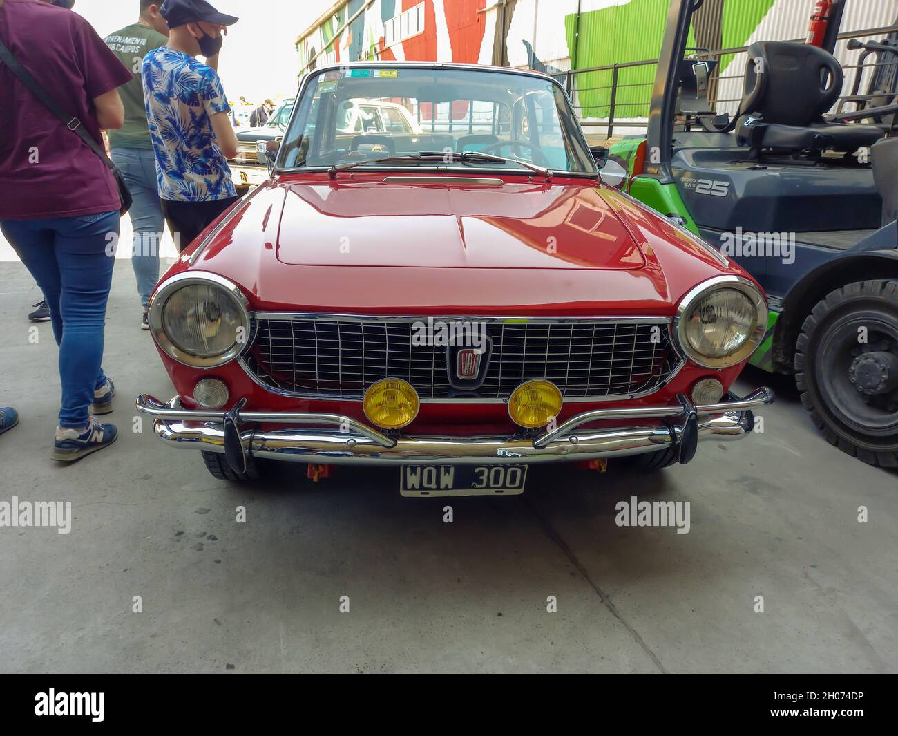 AVELLANEDA - BUENOS AIRES, ARGENTINA - Sep 27, 2021: Avellaneda, Argentina - Sept 26, 2021 - Fiat 1500 coupe Vignale 1970. Red sporty classic car buil Stock Photo