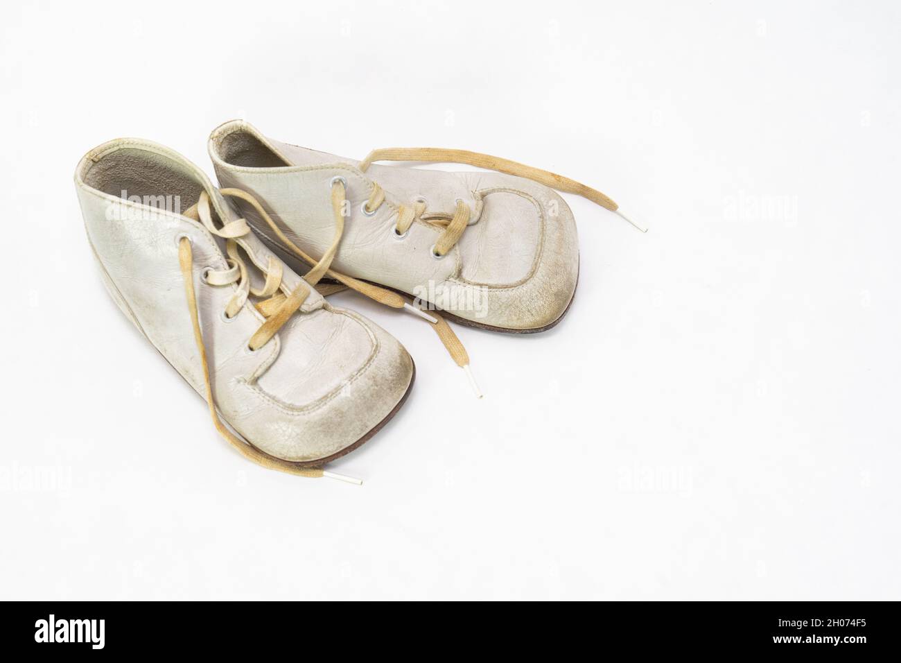Vintage leather white baby shoes Stock Photo - Alamy