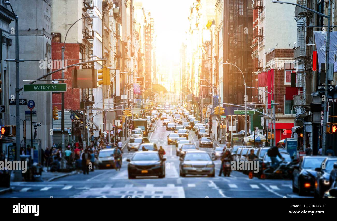 Busy intersections along Broadway are crowded with people and traffic in the streets of Lower Manhattan in New York City NYC Stock Photo