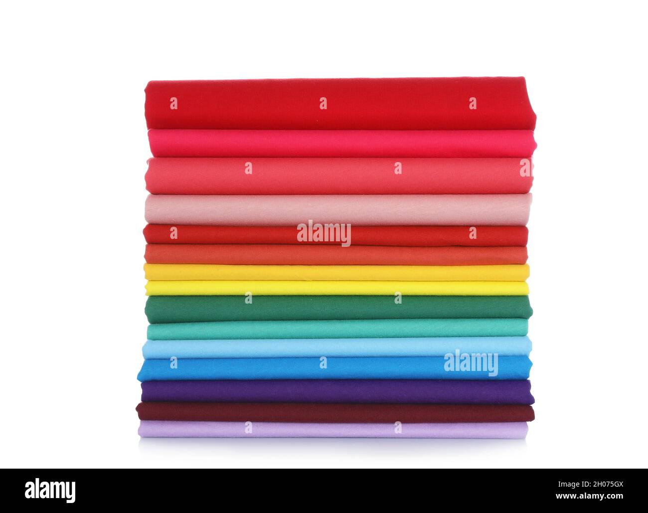 Pile of colorful t-shirts on white background Stock Photo - Alamy