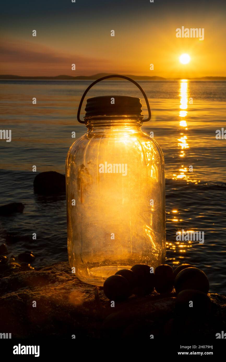 Vintage Glass Bottle lantern lit up from the sunset Stock Photo Alamy
