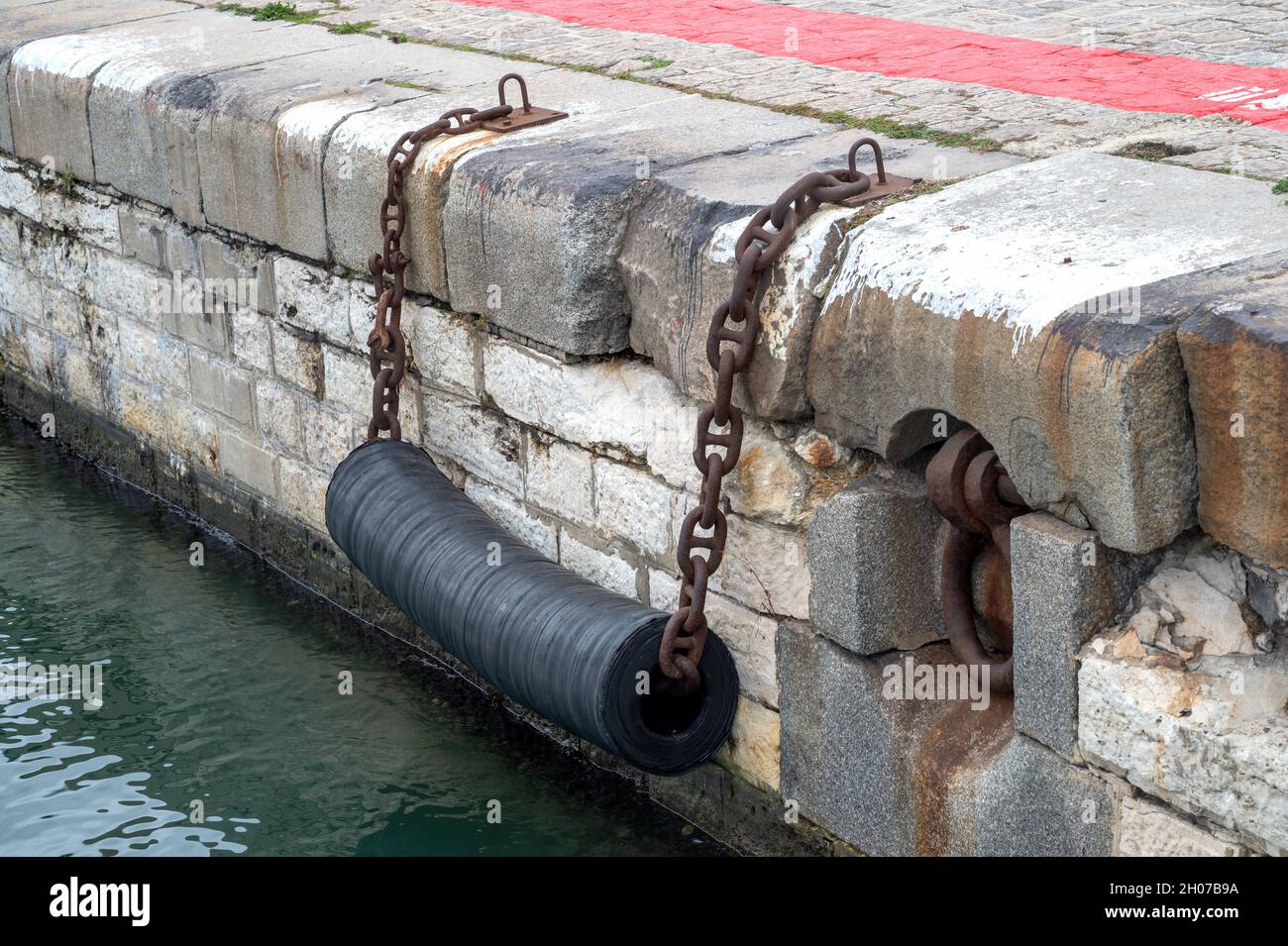 Fenders to moor ships in a harbor Stock Photo Alamy