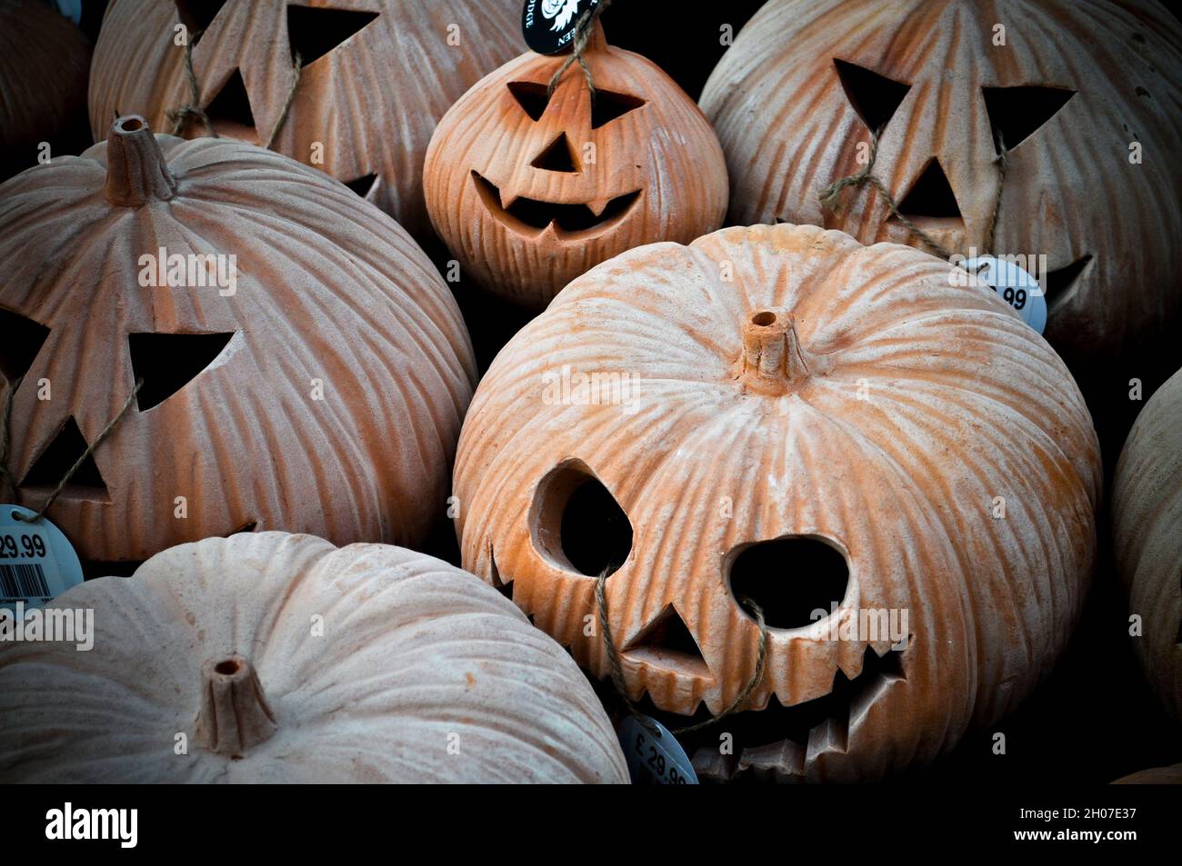A display of terracotta pumpkins for sale at a garden centre Stock