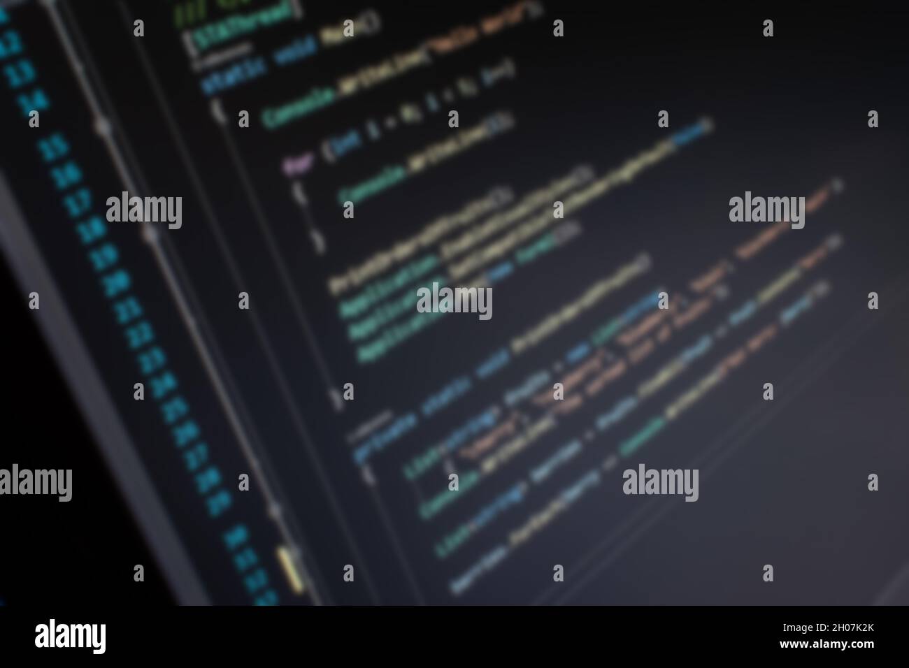 C# Hello World code on screen blurry background image Stock Photo