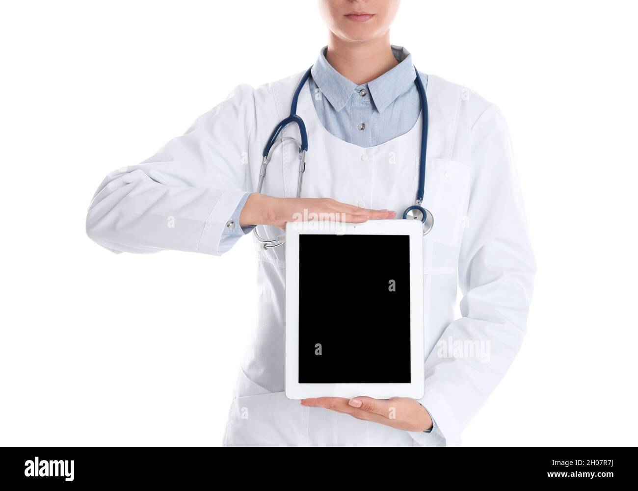 Female doctor holding modern tablet on white background, closeup. Space ...