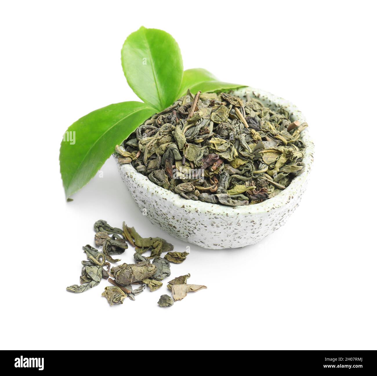 Bowl with dry and fresh tea leaves on white background Stock Photo - Alamy