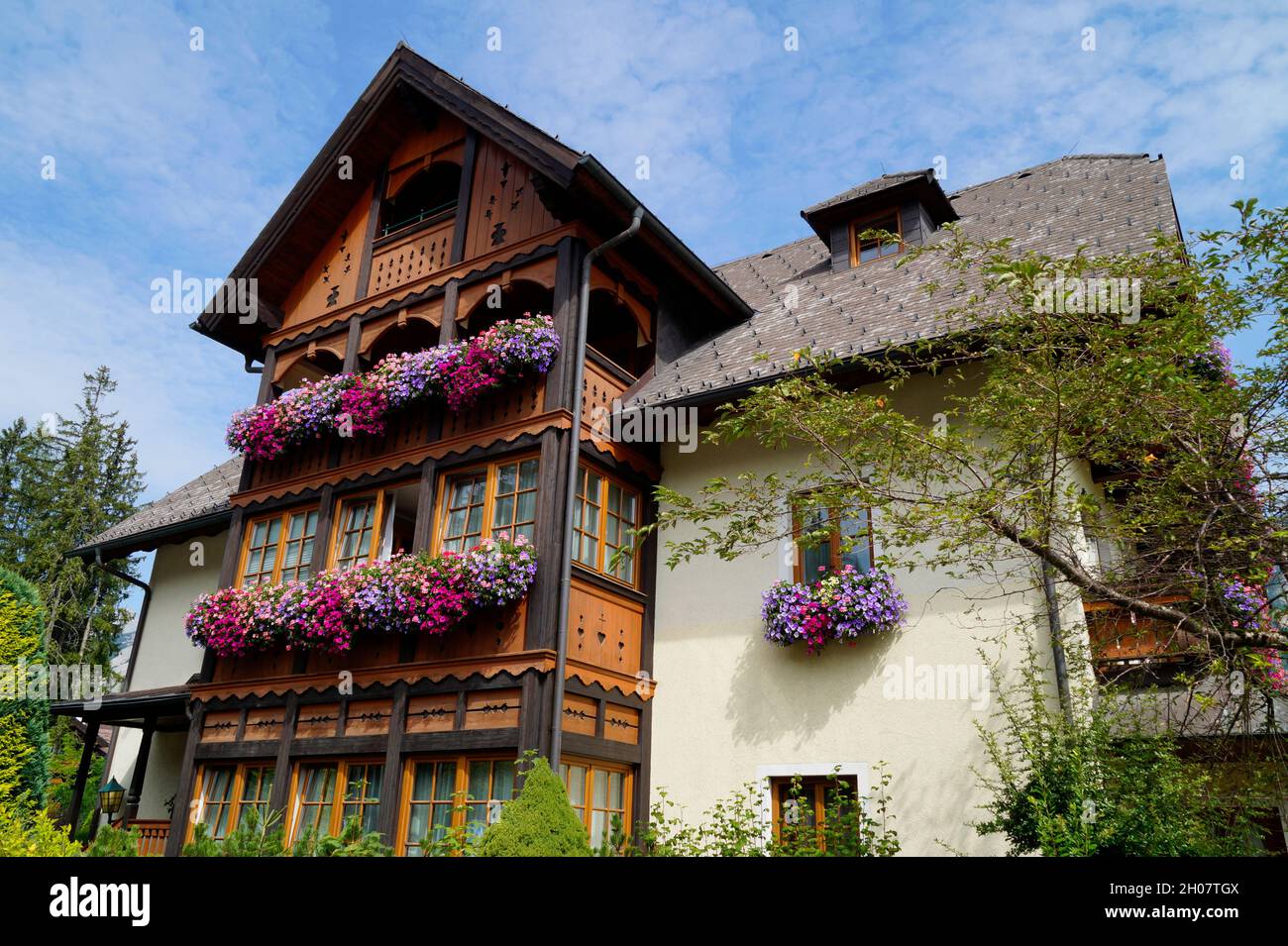 a rustic house with geraniums on the windowsill in the Schladming ...