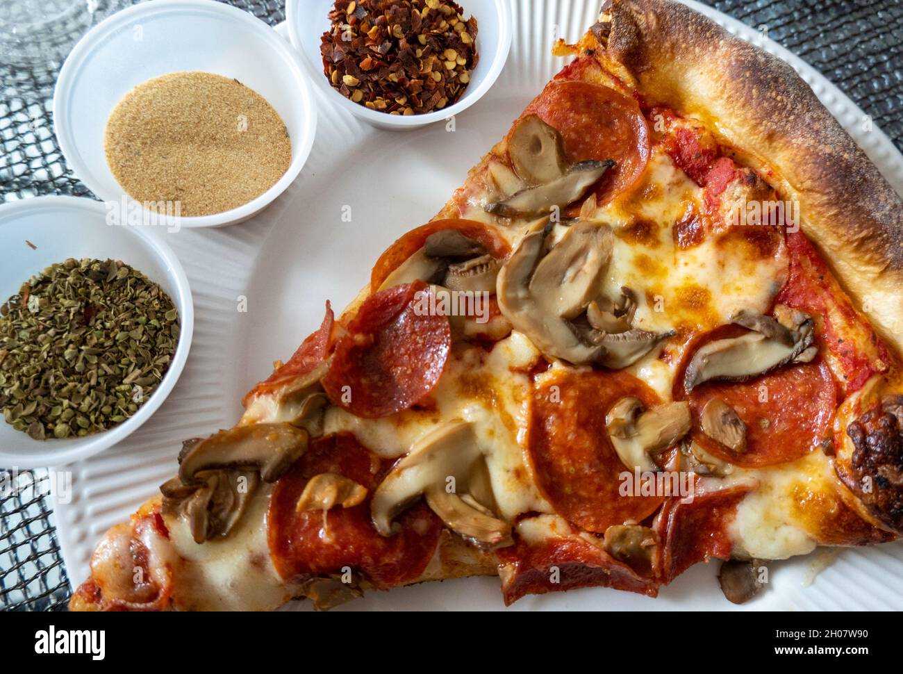 Close up of Pepperoni and mushroom pizza slice, USA Stock Photo