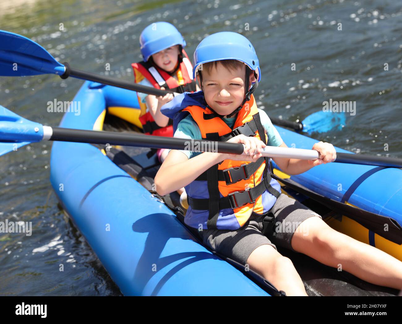 Little children kayaking on river. Summer camp Stock Photo Alamy