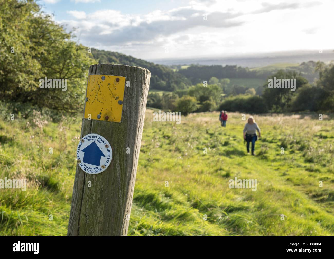 Walkers walking on the North York Moors bridleway above Gormire Lake