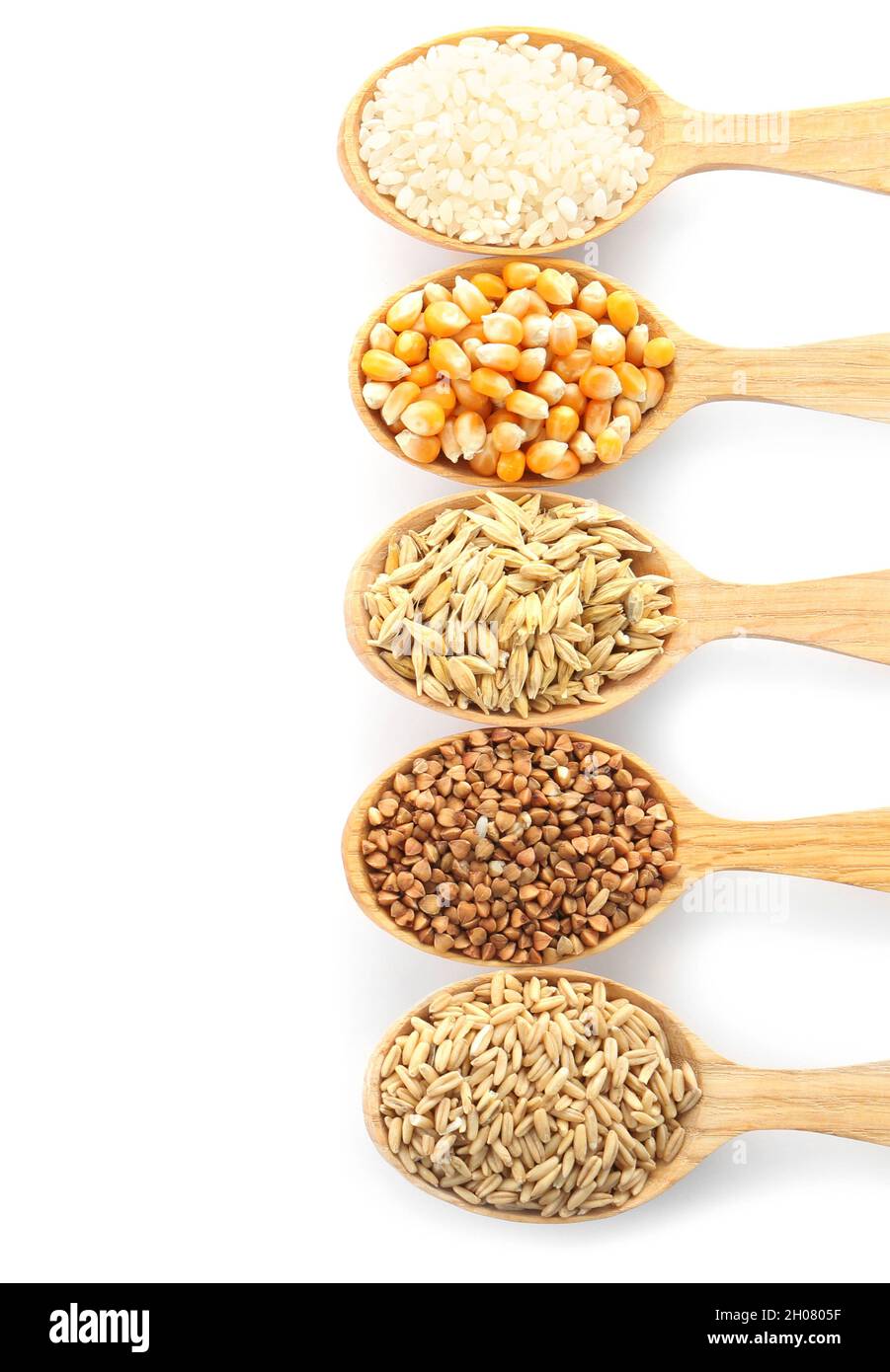 Spoons with different types of grains and cereals on white background