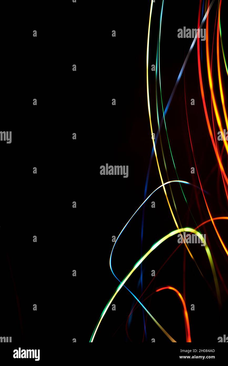 Abstract background, colorful light lines over black background ...