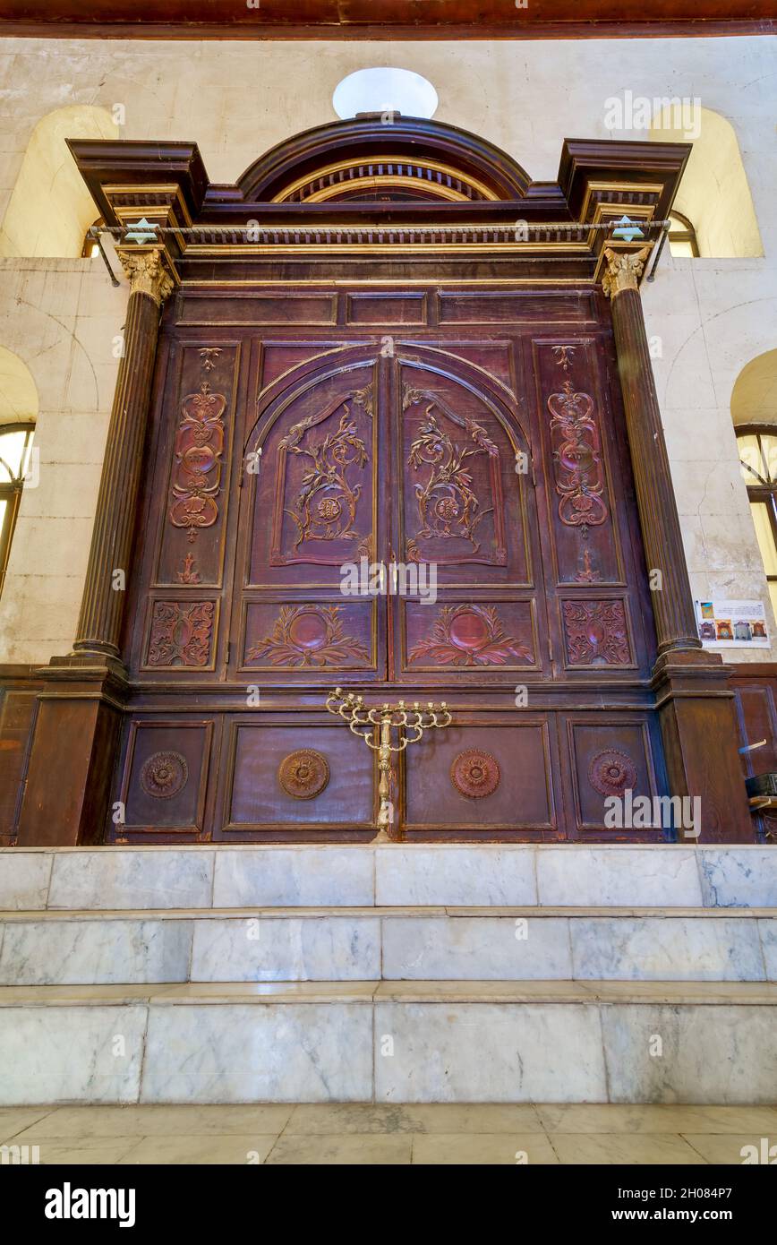 Wooden decorated entrance of historic Jewish Maimonides Synagogue or Rav Moshe Synagogue with arched windows and chandelier in Gamalia district, Cairo Egypt Stock Photo