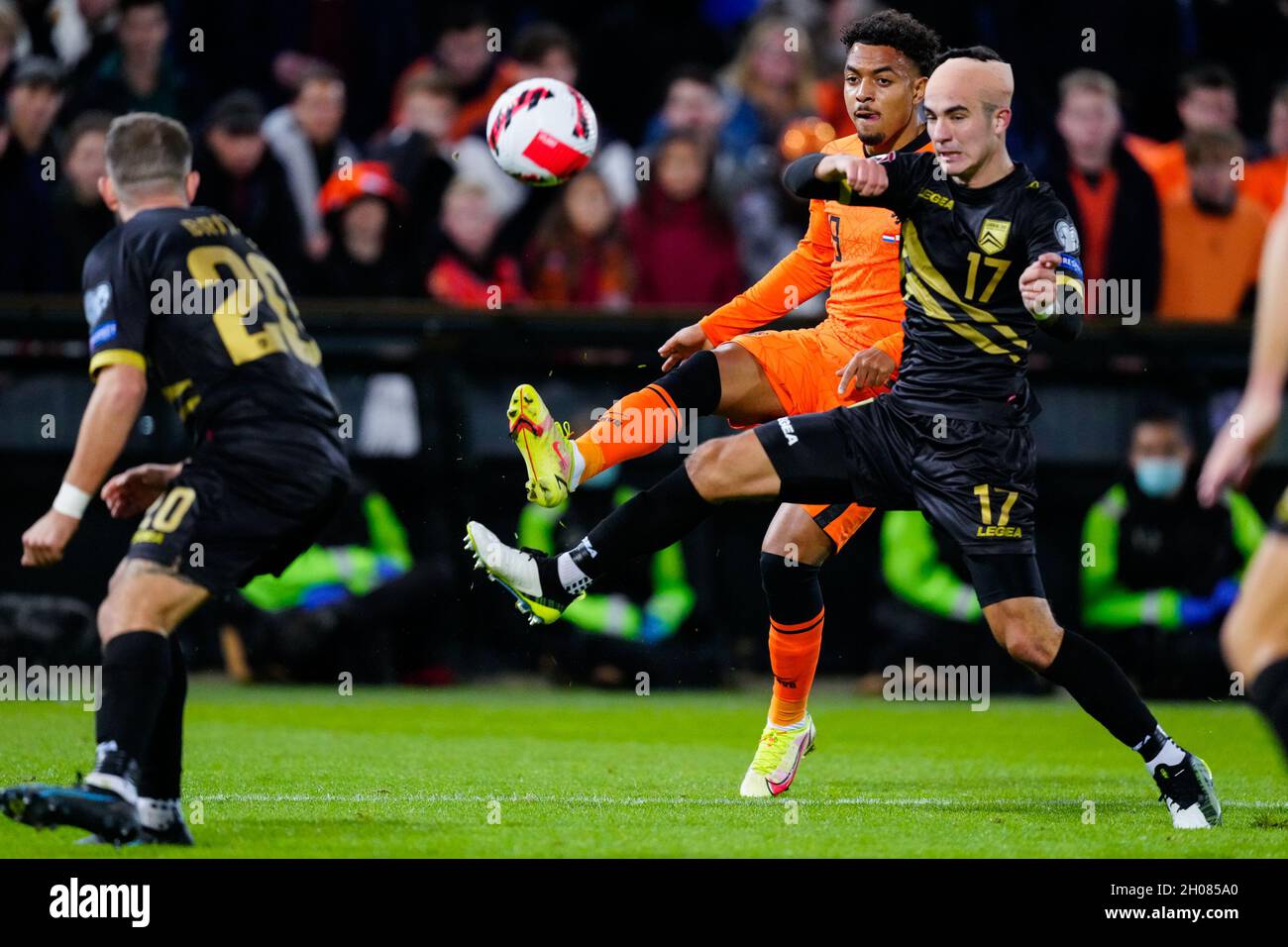 ROTTERDAM, NETHERLANDS - OCTOBER 11: Donyell Malen of the Netherlands and Kian Ronan of Gibraltar during the 2022 FIFA World Cup Qualifier match between Netherlands and Gibraltar at Stadion Feijenoord on October 11, 2021 in Rotterdam, Netherlands (Photo by Geert van Erven/Orange Pictures) Stock Photo