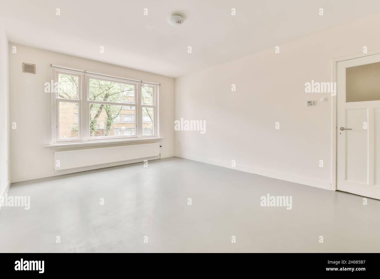 Beautiful renovated empty white room interior with windows Stock Photo ...