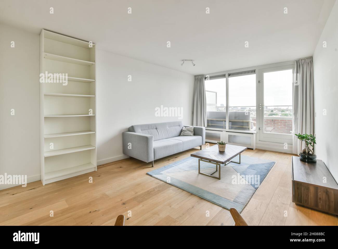Interior shot of a living room with some furniture with white walls and ...