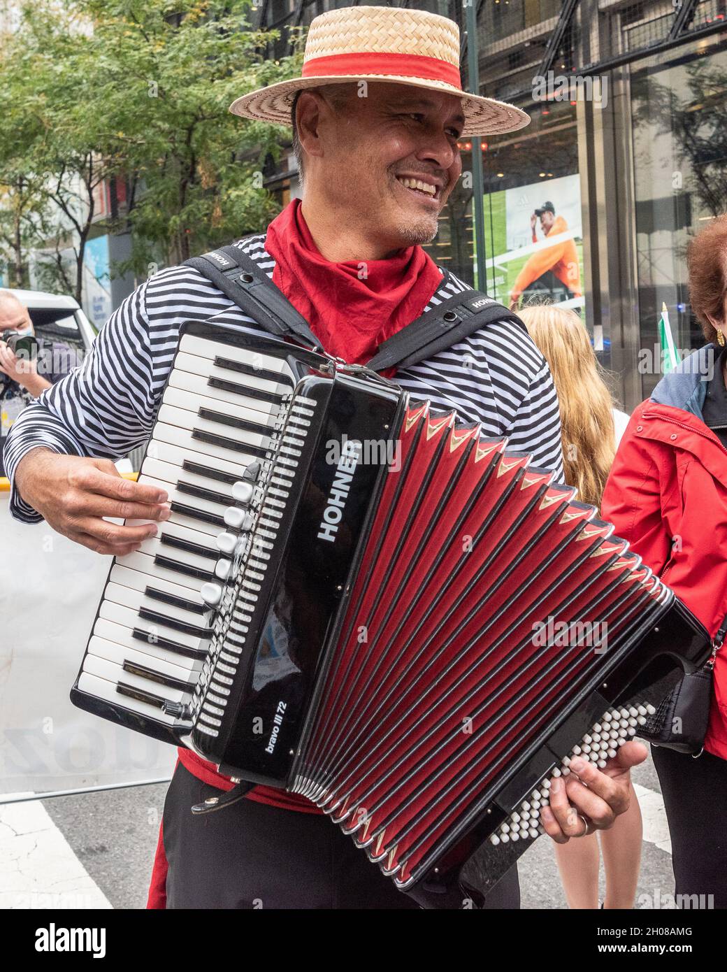 An accordion players entertains the crowd with Italian tunes during the