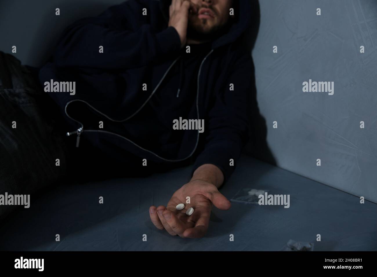 Young addicted man holding drugs, closeup view Stock Photo Alamy