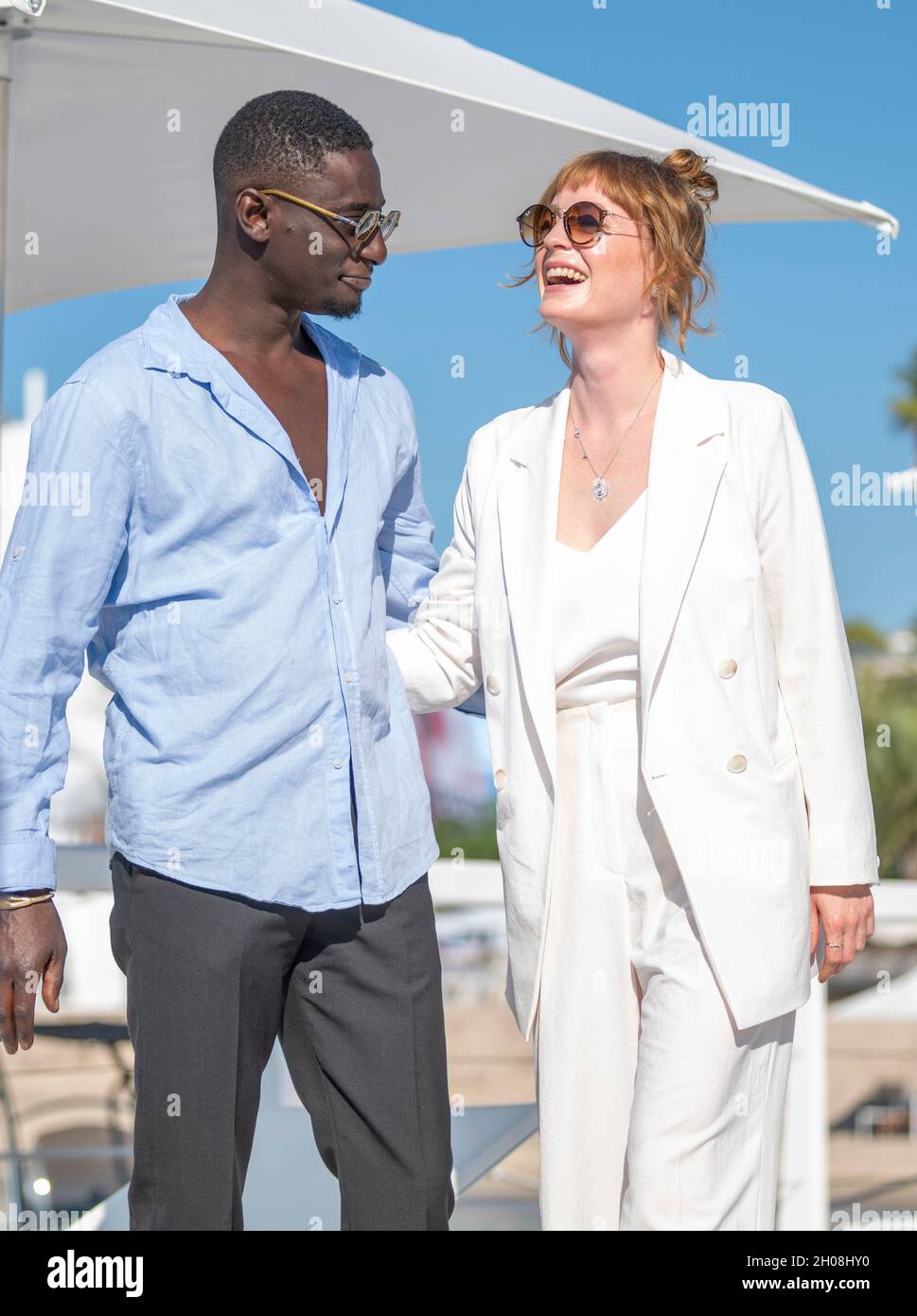 Cannes, France, 11 October 2021, LEONIE BENESH (actress) and IBRAHIM KOMA (actor) at the photo call for 'LE TOUR DU MONDE EN 80 JOURS' during MIPCOM 2021 - The World’s Entertainment Content Market and the 4rd Canneseries - International Series Festival © ifnm press / Alamy Live News Stock Photo