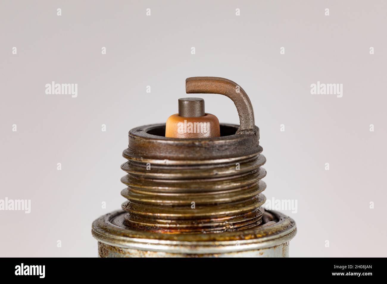 Vehicle engine spark plug isolated on white background. Automotive and small engine repair, maintenance and service concept Stock Photo