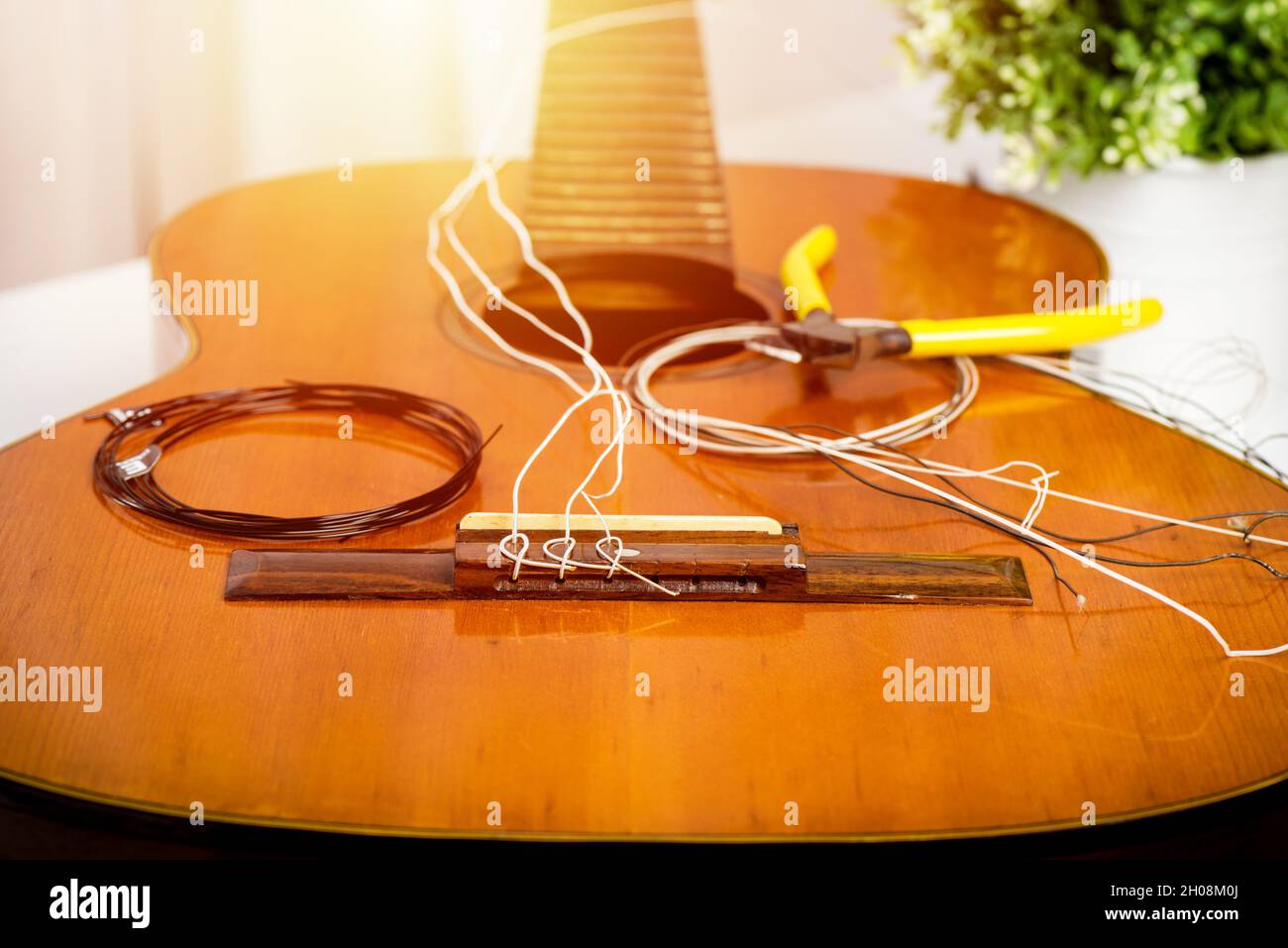 Restring classical guitar concept. Closeup at the new strings Stock