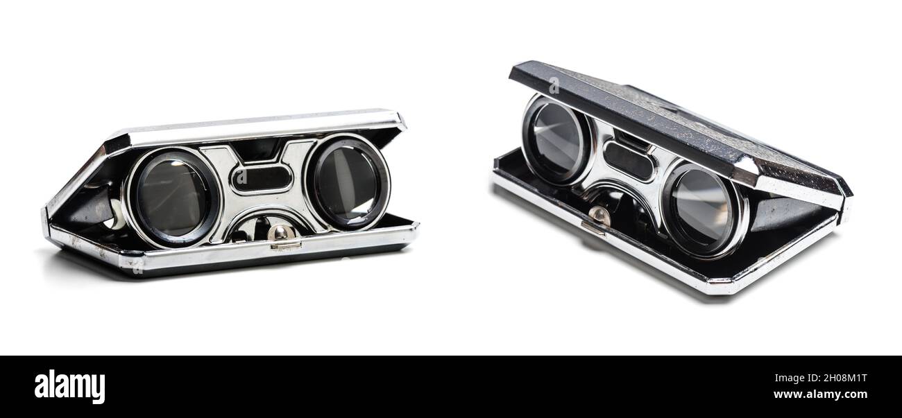 closeup vintage folding opera glasses. Old compact binoculars. Stock Photo