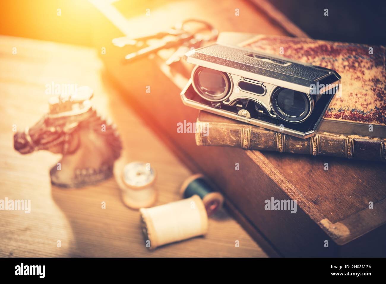 Closeup vintage folding opera glasses. Old compact binoculars. Stock Photo
