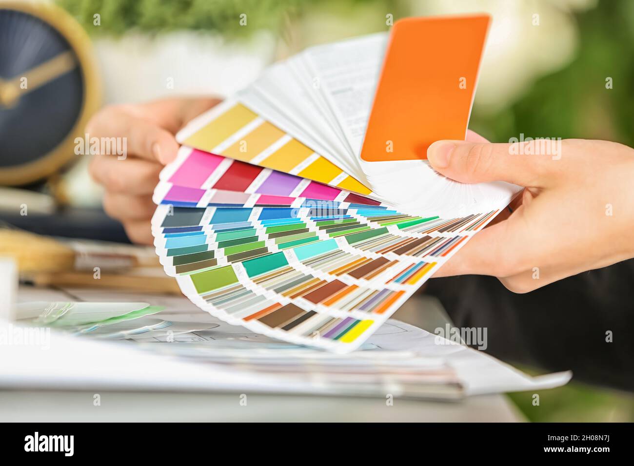 Working With Color Female designer working with color palette samples at table Stock Photo ...