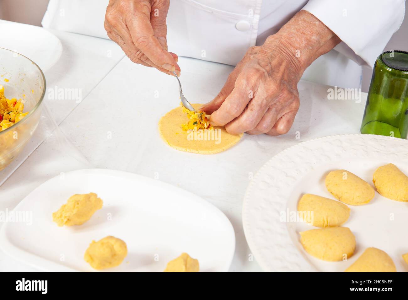 Preparation of the traditional patties from ghe region of Cauca in Colombia, called empanadas de pipián Stock Photo