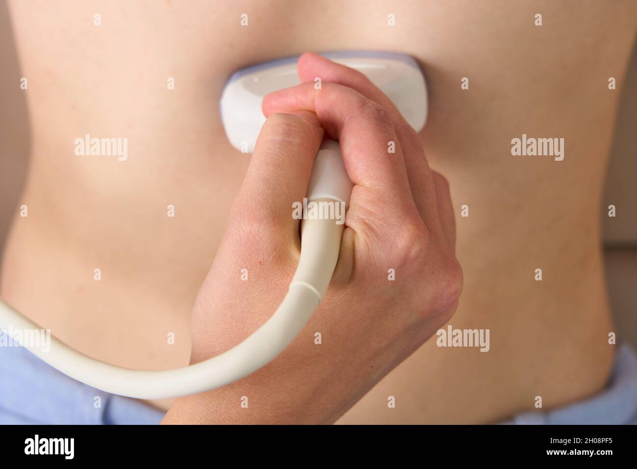 Closeup of ultrasound scan of abdominal cavity with convex probe. Organ diagnostics at home Stock Photo