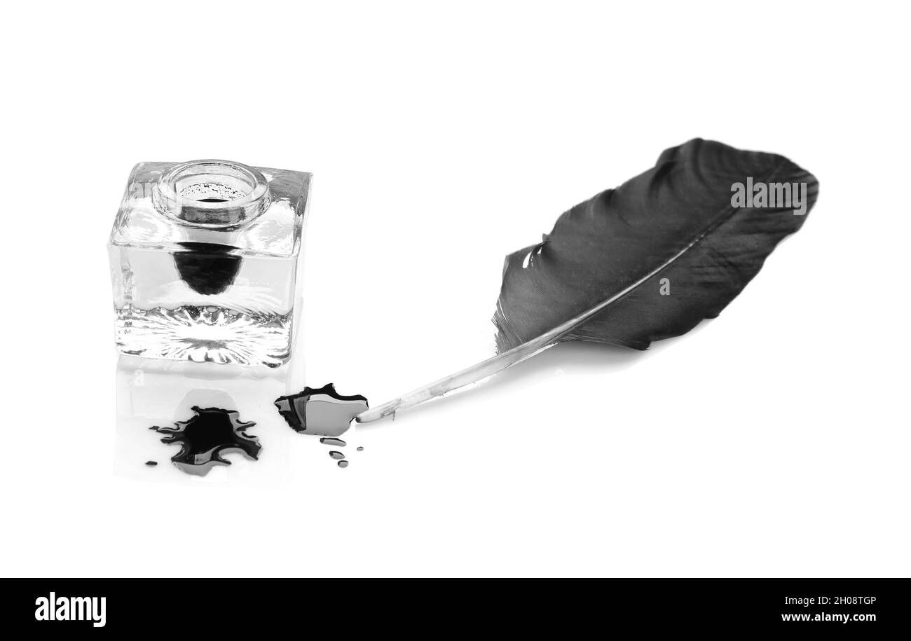 Feather pen and inkwell on white background Stock Photo - Alamy