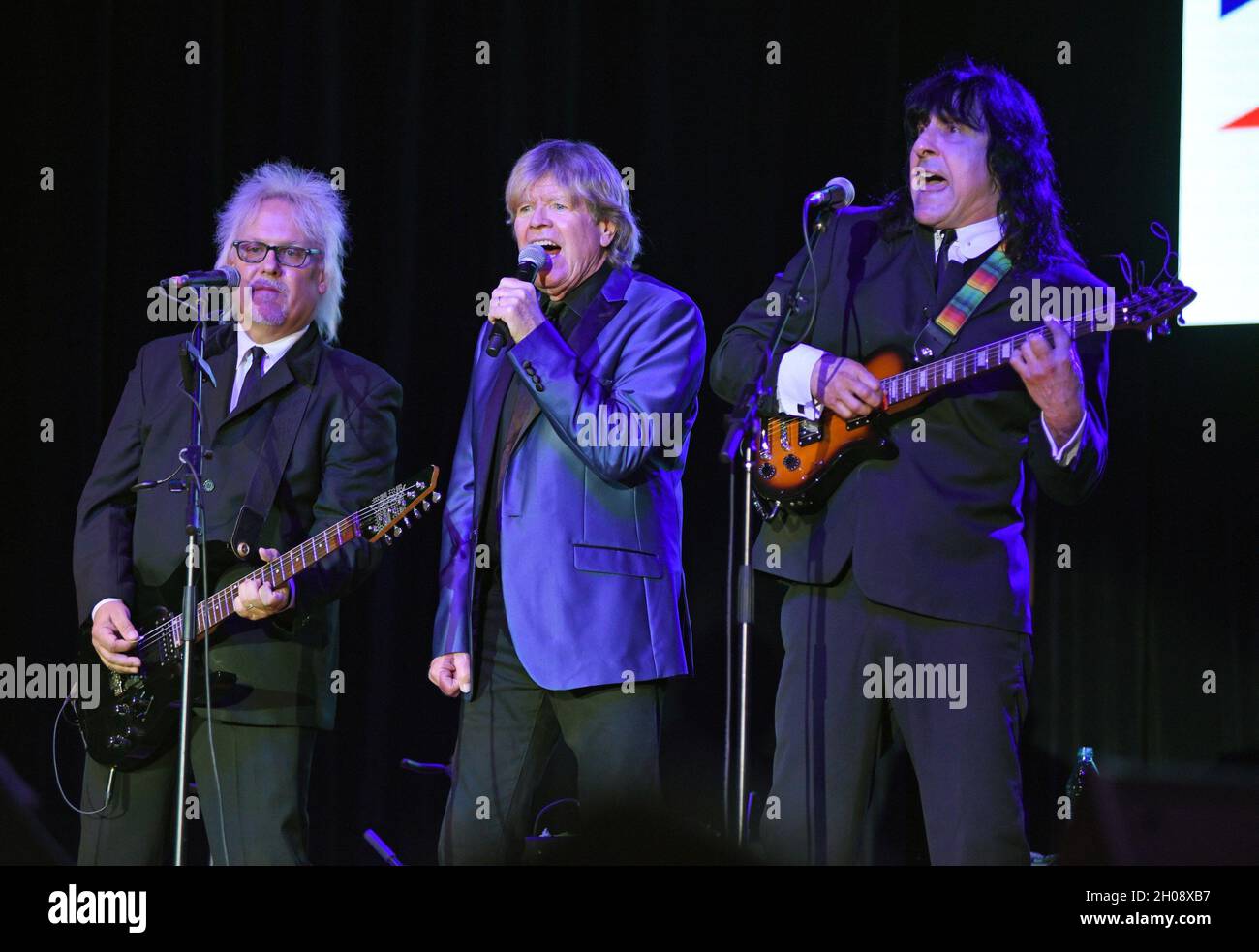 Hiawassee, GA, USA. 11th Oct, 2021. Kevin Lingard, Peter Noone, Vance Brescia on stage for Peter Noone in Concert at Georgia Mountain Fall Fair, Anderson Music Hall, Hiawassee, GA October 11, 2021. Credit: Derek Storm/Everett Collection/Alamy Live News Stock Photo