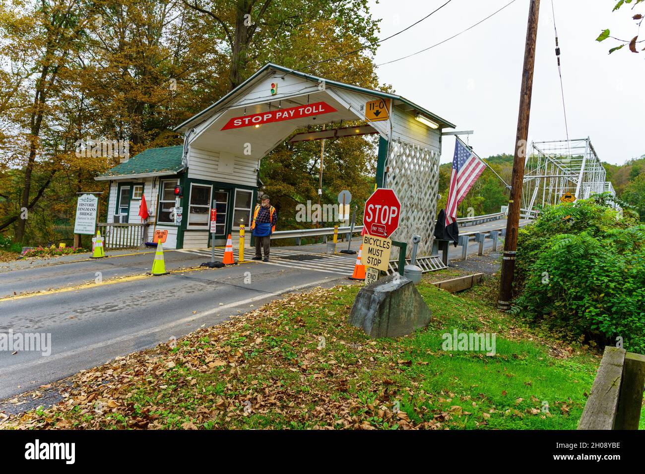 Dingmans Ferry, PA, USA October 10, 2021 A toll collector waits for the next car to use the