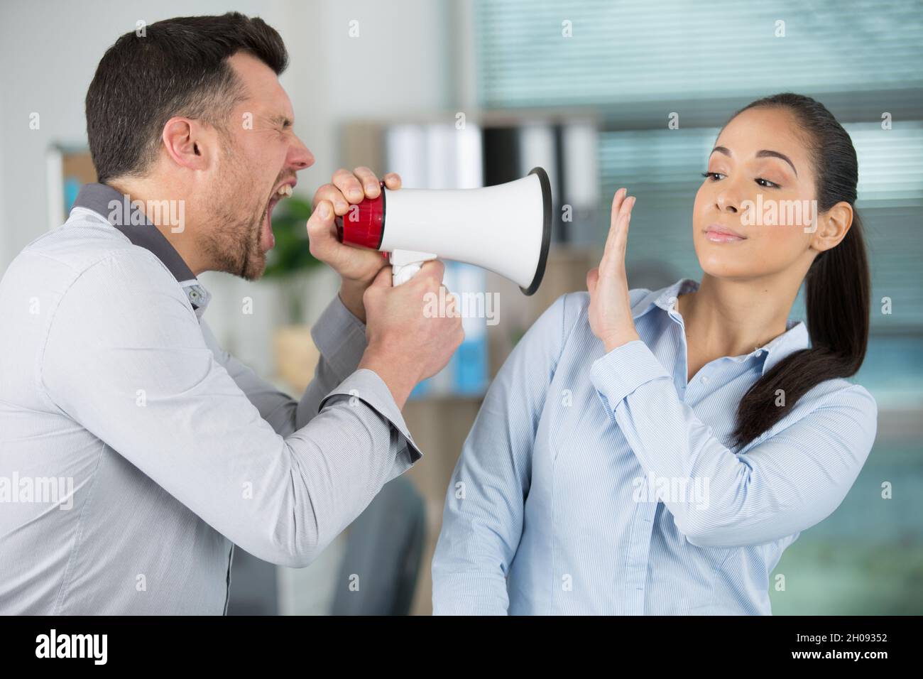 Office shouting on loudspeaker hi-res stock photography and images - Alamy